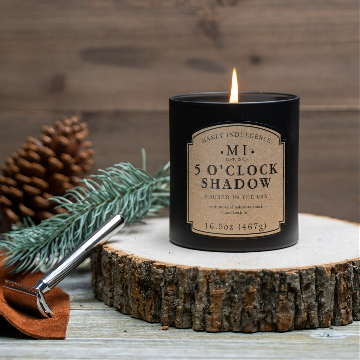 an image of the candle five O'clock shadow set on a block of wood