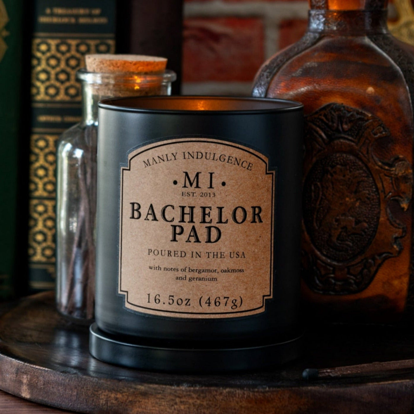 image of the product classic plus bachelor pad placed on a wooden board with botanicals and bourbon placed in the background