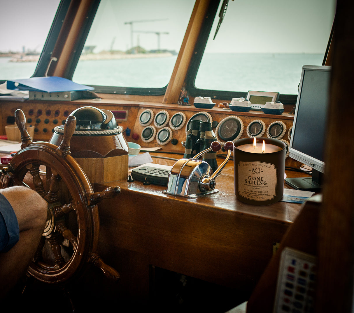 a picture of a candle placed on the inner deck of  boat at sea