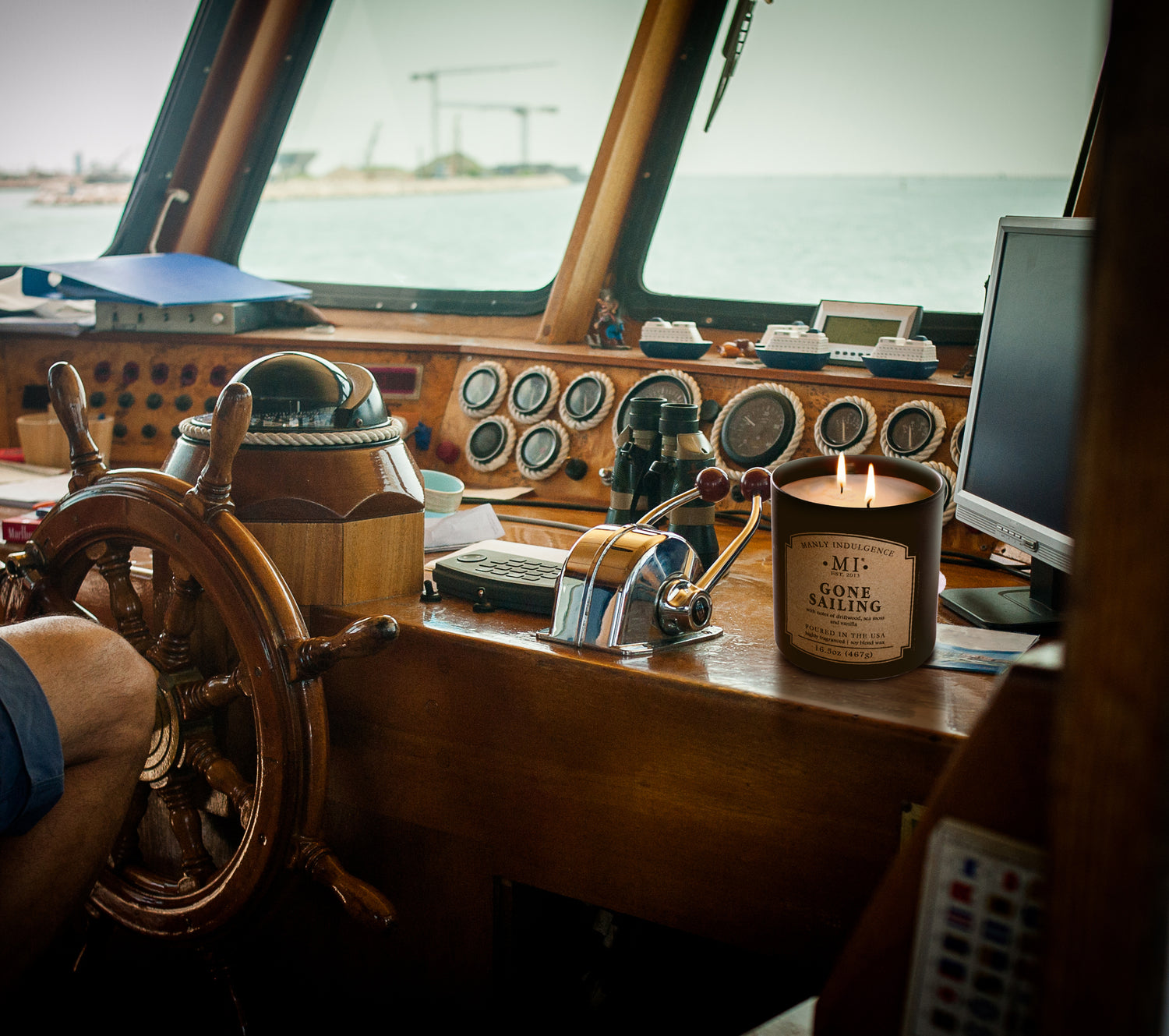 a picture of a candle placed on the inner deck of  boat at sea