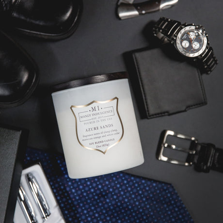 image of the product Signature Azure Sands placed on a table. a watch, wallet, shoe, tie and pens are placed next to it