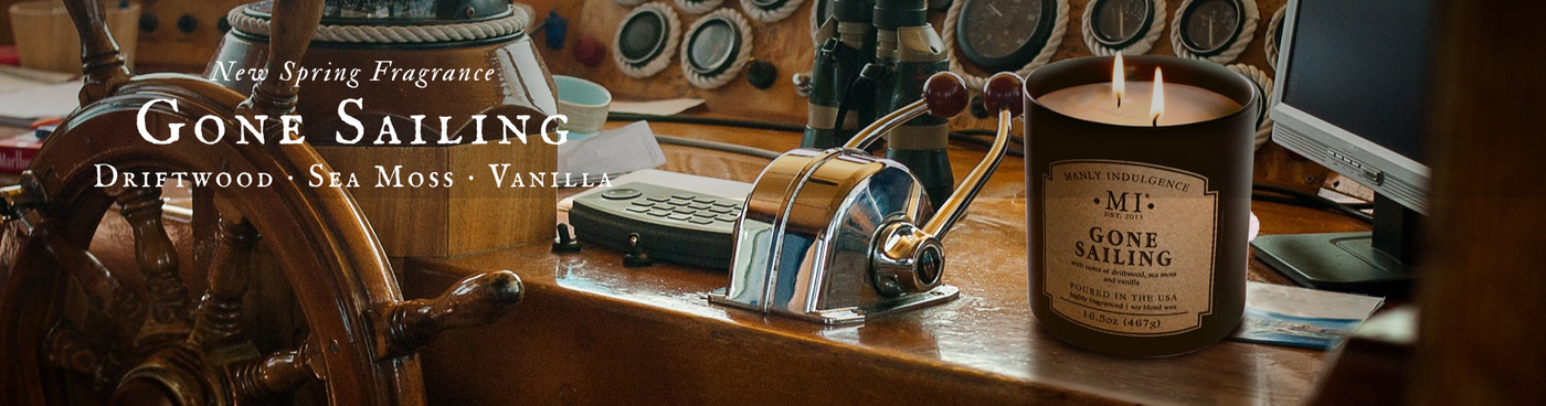 A horizontal image of manly indulgence candle Classic Plus Gone Sailing set inside a boat